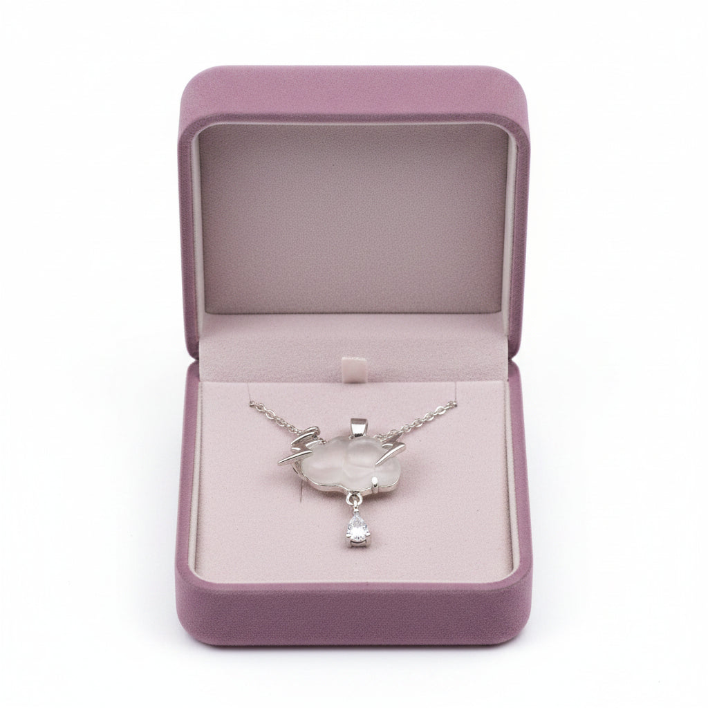 Yoniq.woman silver cloud pendant necklace with lightning bolts and a dangling teardrop crystal on a delicate chain