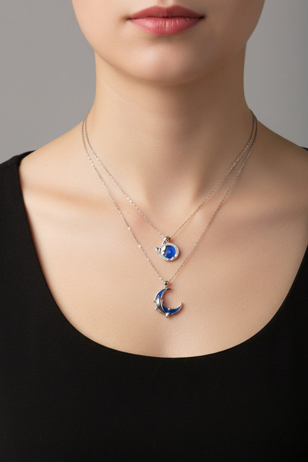 Yoniq.woman silver-tone crescent moon and dolphin pendant necklace with blue enamel inlay on a delicate chain