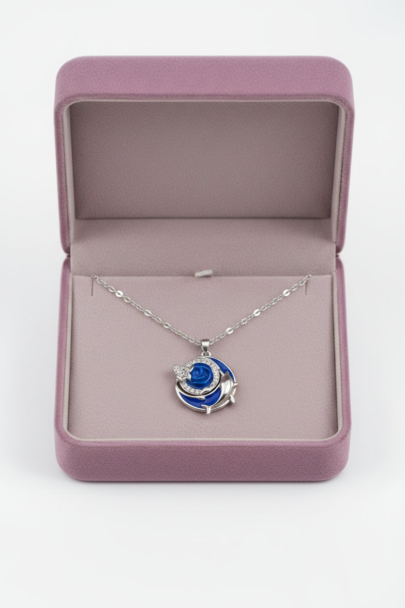 Yoniq.woman silver-tone crescent moon and dolphin pendant necklace with blue enamel inlay on a delicate chain.