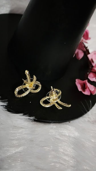 Yoniq.woman gold-tone bow stud earrings with a twisted rope texture and secure post-back closures.