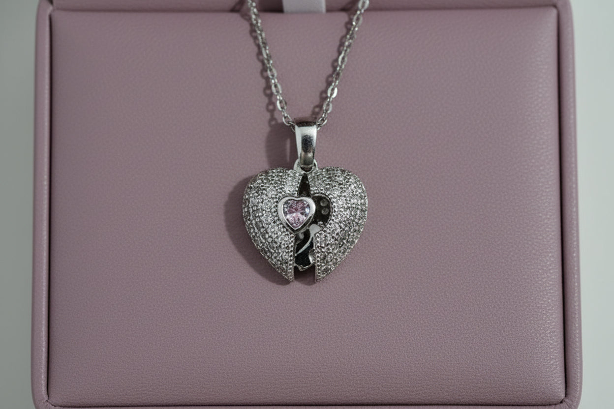 Yoniq.woman silver-tone split heart pendant necklace with shimmering cubic zirconia stones and a central solitaire.