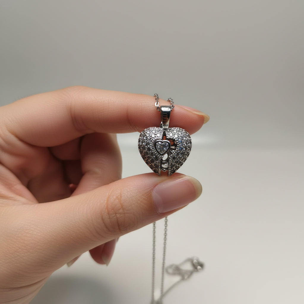 Yoniq.woman silver-tone heart pendant necklace with shimmering cubic zirconia stones and a split-heart center design.